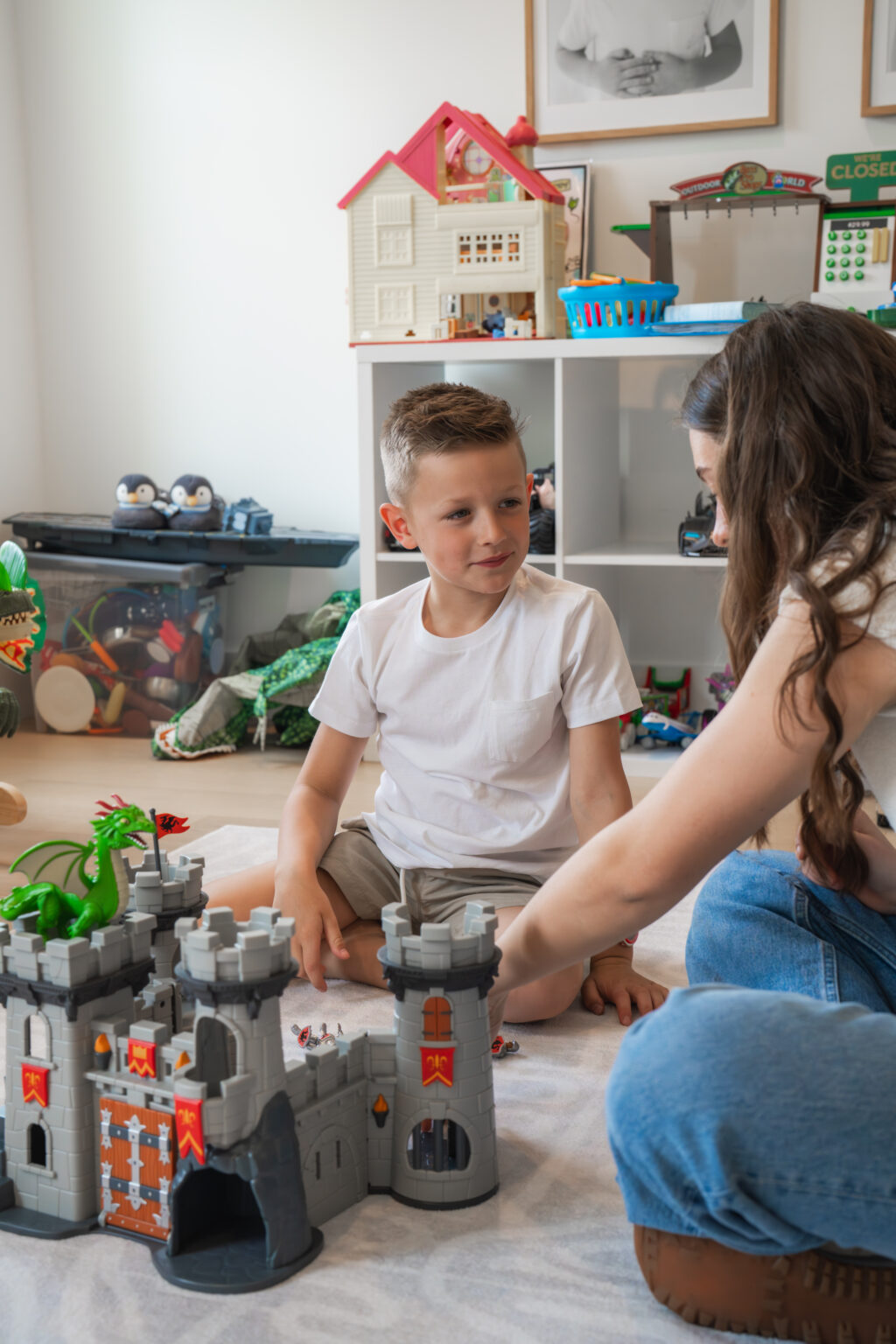 Sitter with a boy in the playroom